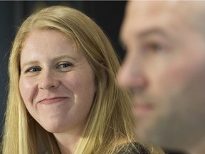 Canadian canoeist Laurence Vincent Lapointe, left, looks on as her lawyer Adam Klevinas speaks during a news conference in Montreal, Monday, January 27, 2020. Vincent Lapointe was cleared by an anti-doping panel and allowed to return to competition and training.