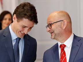 David Lametti speaks to Prime Minister Justin Trudeau after being presented as Minister of Justice and Attorney General of Canada at Rideau Hall in Ottawa, November 20, 2019.