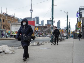 A pedestrian wears a protective mask in Toronto on Monday, January 27, 2020.