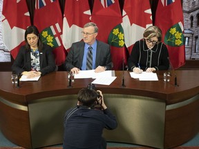 Dr. David Williams, Chief Medical Officer of Health for Ontario, centre, Dr. Barbara Yaffe, right, Associate Chief Medical Officer of Health and Dr. Eileen de Villa, Medical Officer of Health for the City of Toronto attend a news conference in Toronto, on Monday, January 27, 2020, as officials provide an update on the coronavirus in Canada.