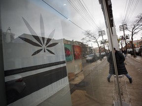 A customer walks into a Cannabis dispensary on Queen St. in Toronto, Monday, Jan. 6, 2020.