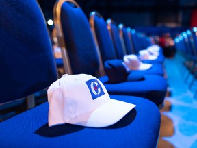Hats wait to be claimed by VIPs in a reserved seating area at the Conservative party's election day headquarters in Regina, on Oct. 21, 2019.