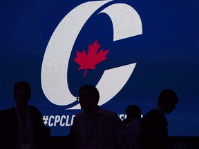 Supporters take their seats during the opening night of the federal Conservative leadership convention in Toronto on May 26, 2017.