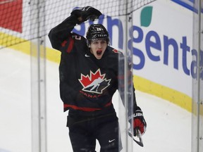Canada's Dylan Cozens celebrates after scoring his sides first goal during the U20 Ice Hockey Worlds gold medal match between Canada and Russia in Ostrava, Czech Republic, Sunday, Jan. 5, 2020. The first Yukon teen ever to play for Canada's world junior hockey team received a boisterous welcome as he returned to the territory early Tuesday.