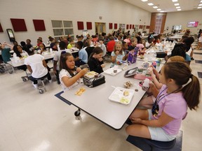 Students at Madison Crossing Elementary School in Canton, Miss., eat lunch in the school's cafeteria on Friday, Aug. 9, 2019. The federal Liberals are being told to avoid creating a one-size-fits-all national school-food program.