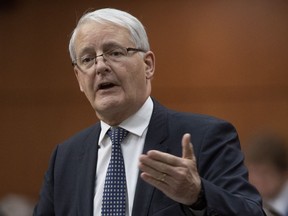 Minister of Transport Minister Marc Garneau responds to a question during Question Period in the House of Commons Thursday December 12, 2019 in Ottawa. A new federal rebate program to encourage Canadians to buy electric cars is proving more popular than expected.