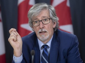 Privacy Commissioner Daniel Therrien speaks during a news conference in Ottawa, Tuesday, December 10, 2019. The federal privacy czar says Canada's border agency violated the law by carrying out overly invasive searches of personal digital devices, in one case viewing a traveller's social media and online banking information.