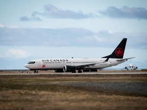 An Air Canada Boeing 737 Max 8 aircraft departing for Calgary taxis to a runway at Vancouver International Airport in Richmond, B.C., on Tuesday, March 12, 2019. Canada's nuclear safety regulator is looking to draw valuable lessons from an unexpected source, the recent Boeing 737 Max airplane accidents.