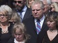 Doug Ford (centre right) cries as he stands with his mother Diane (left) sister-in-law Renata (right) and niece Stephanie as they watch Rob Ford's casket being placed into a hearse following a funeral service at Toronto's St. James Cathedral on Wednesday, March 30, 2016. Diane Ford, the mother of Ontario Premier Doug Ford and the late Toronto mayor Rob Ford, has died at the age of 85.