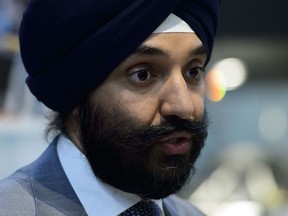 Innovation Minister Navdeep Bains holds a press conference in Ottawa on Wednesday, July 24, 2019. The federal government is making clear that cuts to wireless rates it expects from mobile service providers must go above and beyond any price reductions already seen since 2016. Bains says the 25 per cent rate reductions he has been mandated to achieve over the next two years will be measured from after the October election.