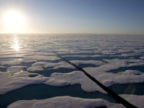 The midnight sun shines over the ice covered waters near Resolute bay at 1:30am as seen from the Canadian Coast Guard icebreaker Louis S. St-Laurent Saturday, July 12, 2008. The Louis is on its annual voyage through Canada's Arctic that includes patrols through the Northwest Passage. Environmental groups are applauding what they call a trend among international shippers and shipping companies to voluntarily promise to stay away from controversial Arctic routes.