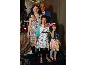 Pedram Mousavi and his wife Mojgan Daneshmand and their two daughters (from left) Daria and Dorina are shown in a handout photo. The family of four from Edmonton is among the victims of the plane crash in Iran.