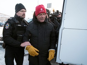 Unifor national president Jerry Dias is arrested by Regina Police on the picket line of the lockout by Federated Co-operatives Limited (FCL)  at the Co-op Refinery Complex in Regina on Jan. 20, 2020.