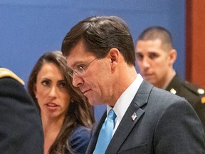 Former Secretary of Defence Mark Esper, front right, walks towards the Senate after briefing members of Congress on the targeted killing of Iran's senior military commander Gen. Qassem Soleimani, Wednesday, Jan. 8, 2020, on Capitol Hill in Washington.