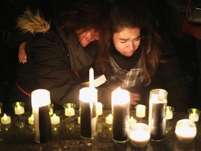 Mourners attend an outdoor vigil for the victims of a Ukrainian passenger jet which crashed in Iran, in Toronto, Ontario, Canada January 9, 2020.