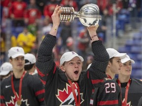 Canada's Bowen Byram celebrates with the trophy after defeating Russia in the gold medal game at the World Junior Hockey Championships Sunday, January 5, 2020 in Ostrava, Czech Republic.