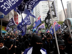 Pro-independence protesters march during an anti-government demonstration on New Year's Day, to call for better governance and democratic reforms in Hong Kong, China, January 1, 2020.