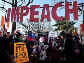 People rally in support of the impeachment of U.S. President Donald Trump, in front of the U.S. Capitol on Dec. 18, 2019.