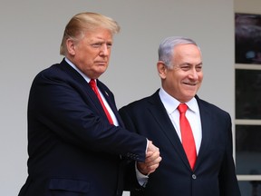 In this Monday, March 25, 2019 file photo, President Donald Trump welcomes visiting Israeli Prime Minister Benjamin Netanyahu to the White House in Washington. In a tight race for re-election, Israel’s prime minister has gotten a welcome lift from his friend in the White House. In the run-up to the April 9 vote, Netanyahu has hosted Secretary of State Mike Pompeo, visited Trump in the White House and received American recognition of Israeli sovereignty over the Golan Heights, which Israel seized from Syria during the 1967 Mideast war.