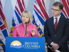 British Columbia Health Minister Adrian Dix looks on as Provincial Health Officer Dr. Bonnie Henry addresses the media during a news conference at the BC Centre of Disease Control in Vancouver B.C, Tuesday, January 28, 2020. Dix and Dr. Henry announced Tuesday that British Columbia has confirmed its first case of coronavirus and the person in question is being treated.