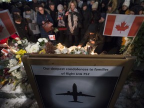 Mourners attend a memorial to remember Canadian victims in last week's deadly downing of a Ukrainian airliner in Iran, in North Vancouver, B.C., Tuesday, Jan. 14, 2020.