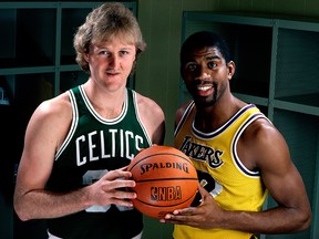 Larry Bird of the Boston Celtics poses for a portrait with Magic Johnson of the Los Angeles Lakers at the Great Western Forum on Jan. 1, 1983, in Los Angeles, Calif.