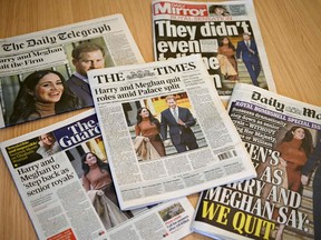 An arrangement of UK daily newspapers photographed as an illustration in London on January 9, 2020, shows front page headlines reporting on the news that Britain's Prince Harry, Duke of Sussex and his wife Meghan, Duchess of Sussex, plan to step back as "senior" members of the Royal Family.