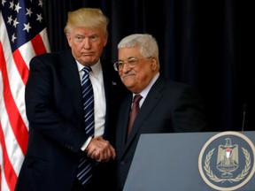 U.S. President Donald Trump shakes hands with Palestinian President Mahmoud Abbas during a joint news conference at the presidential headquarters in the West Bank town of Bethlehem in the Israeli-occupied West Bank May 23, 2017.