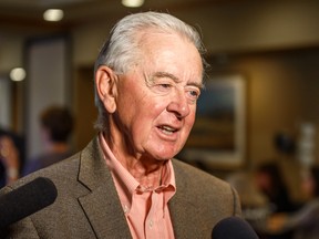 Reform Party founder Preston Manning speaks with reporters after giving a speech in Calgary on Sept. 25, 2019.