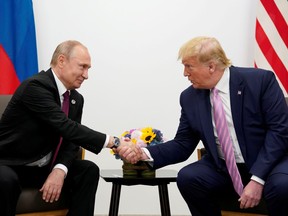 Russia's President Vladimir Putin and U.S. President Donald Trump shake hands during a bilateral meeting at the G20 leaders summit in Osaka, Japan, June 28, 2019.
