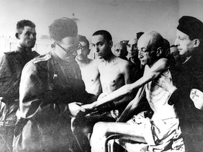 A Soviet military doctor examines Holocaust survivors after the liberation of the Nazi German death camp Auschwitz-Birkenau in Nazi-occupied Poland.