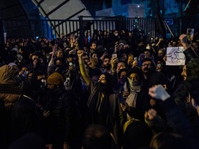 Demonstrators chant while gathering during a vigil for the victims of the Ukraine International Airlines flight that was unintentionally shot down by Iran, in Tehran, Iran, on Jan. 11, 2020.