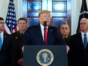 U.S. President Donald Trump delivers a statement about Iran flanked by U.S. Defense Secretary Mark Esper, Army Chief of Staff General James McConville, Chairman of the Joint Chiefs of Staff Army General Mark Milley and Vice President Mike Pence in the Grand Foyer at the White House in Washington, U.S., January 8, 2020.