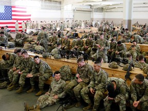 U.S. Army paratroopers assigned to 1st Brigade Combat Team, 82nd Airborne Division prepare to board an aircraft bound for the U.S. Central Command area of operations from Fort Bragg, North Carolina January 5, 2020. Picture taken January 5, 2020.