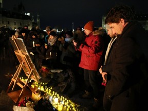 Justin Trudeau Prime Minister of Canada (R) attends a vigil for the victims who were killed in a plane crash in Iran on January 9, 2020 in Ottawa, Canada.