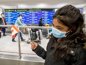 Khaely Gorospe wears a mask at Toronto's Pearson Airport on Jan. 26, 2020. The first case of coronavirus in Canada came through the airport on Jan 22.