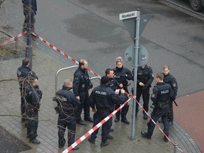 Police officers secure a street near one of the bar target in a shooting at the Heumarkt in the centre of Hanau, near Frankfurt am Main, western Germany, on February 20, 2020, where at least nine people were killed in two shootings late on February 19, 2020.