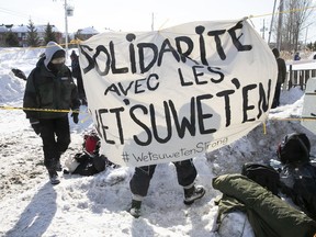 Protesters set blockade on the train tracks in Longueuil near Oak Ave. and St-Georges St. on Wednesday, Feb. 19, 2020.