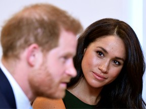 In this file photo taken on October 15, 2019, Harry and Meghan attend the annual WellChild Awards in London.
