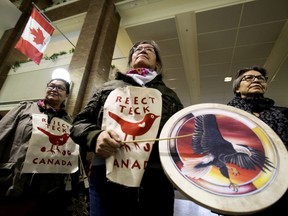 Members of Beaver Hills Warriors and Extinction Rebellion Edmonton protest further expansion of the oil sands, specifically the Teck Frontier Mine, inside Canada Place, in Edmonton Wednesday Jan. 22, 2020.