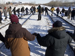 Protesters perform a round dance as they prepare to end their blockade at the CN rail line near 213 Street and 110 Avenue in solidarity with Wet'suwet'en Hereditary Chiefs, in Edmonton Wednesday Feb. 19, 2020.