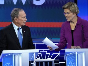 Former New York City Mayor Mike Bloomberg talks with Senator Elizabeth Warren during a break at the ninth Democratic 2020 U.S. Presidential candidates debate at the Paris Theater in Las Vegas Nevada, U.S., February 19, 2020.