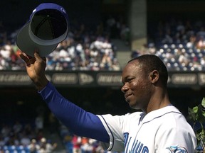 Toronto Blue Jays' Tony Fernandez tips his hat to the crowd as he takes part in a pre-game ceremony against the Tampa Bay Rays in Toronto Sunday September 23, 2001.