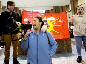 Pihesiw Crane, centre, along with members of the Beaver Hills Warriors and Extinction Rebellion Edmonton protest Teck Resources' Frontier mine project, at Canada Place in Edmonton on Jan. 22, 2020.