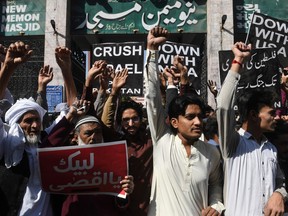 Activist of Palestine Foundation of Pakistan shout anti-US and Israeli slogans during a protest against a US peace plan proposal, in Karachi on January 31, 2020.