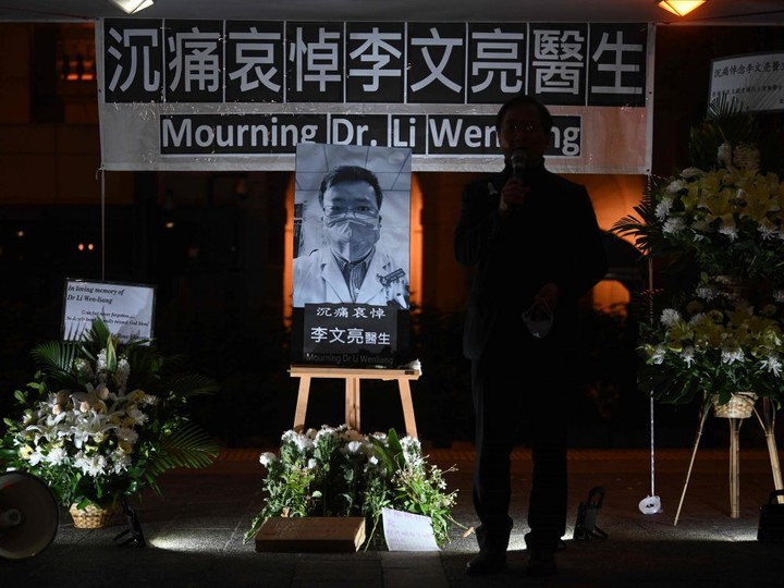  People attend a vigil in Hong Kong on Feb. 7, 2020 for novel coronavirus whistleblowing doctor Li Wenliang (pictured C), 34.