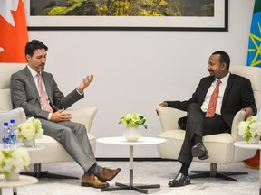 Prime Minister Justin Trudeau, left, speaks with Ethiopian Prime Minister Abiy Ahmed during a meeting in Addis Ababa on Feb. 8.