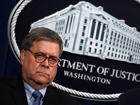 In this file photo taken on January 13, 2020 US Attorney General William Barr holds a press conference at the Department of Justice in Washington, DC.