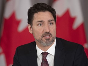 Canadian Prime Minister Justin Trudeau delivers opening remarks at a with Mayors of Canada's largest cities in Ottawa, Thursday February 6, 2020.