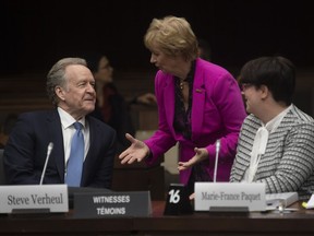 Global Affairs Canada Chief negotiator Steve Verheul and chief economist Marie-France Paquet speak with Chair of the Standing Committee on International Trade Judy Sgro before appearing as witnesses Wednesday February 26, 2020, in Ottawa